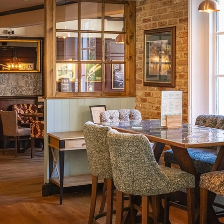 The interior restaurant seating area at The Crown & Horseshoes.