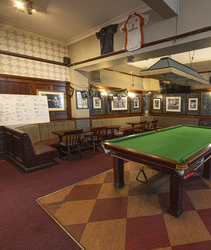 Interior shot of the pool table and seating area