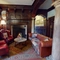 A seating area and fireplace inside The Rothley Court Hotel.