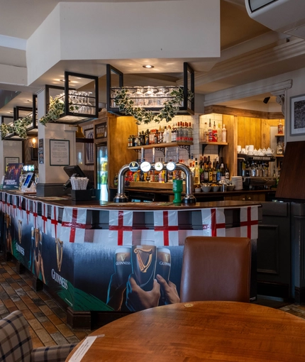 interior dining area of a pub with a bar