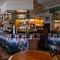 interior dining area of a pub with a bar
