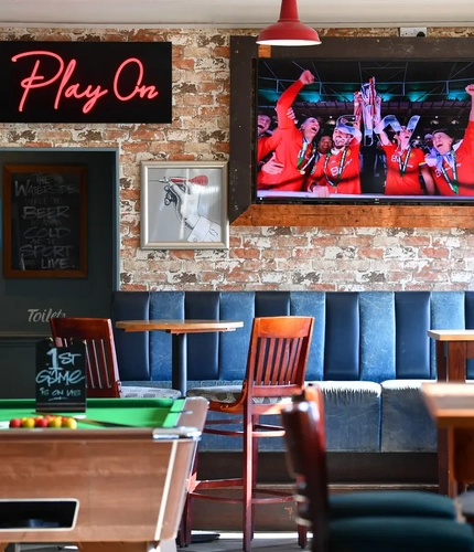 interior restaurant and seating area with a pool table