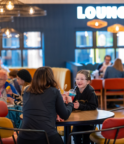 Customers dining in the restaurant and seating area at HighTales.