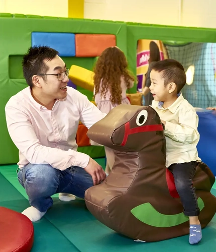 A father and son in the toddler area
