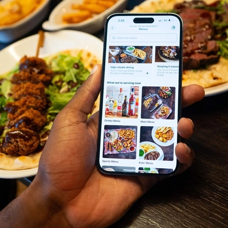 Someone ordering from the Greene King app at Flaming Grill.