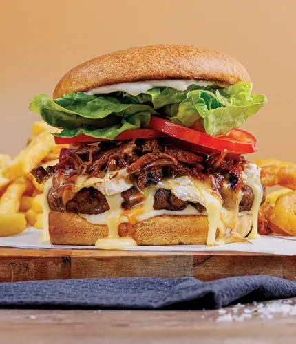 A burger, chips and onion rings