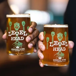 Two people holding pints of beer
