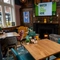 The interior restaurant and seating area with TV and fireplace at the Ship and Royal.