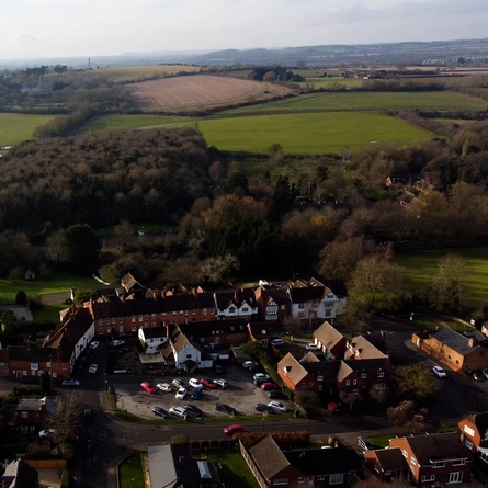 An aerial view of fields, trees and houses near The Bell at Stratford-Upon-Avon.