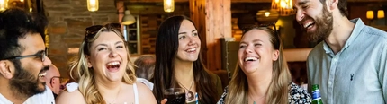 People laughing in a pub