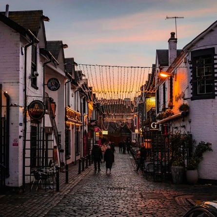 An exterior shot of the landscape & facade at the Ubiquitous Chip in Glasgow.
