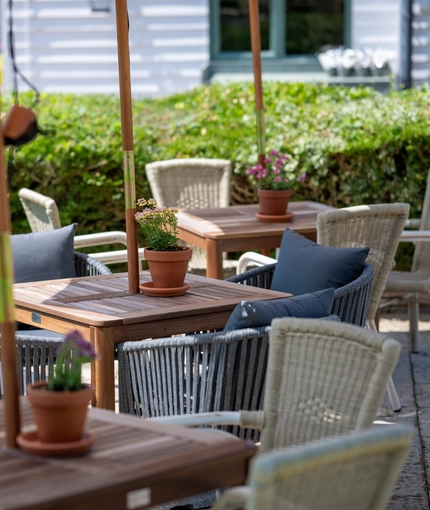 Some beer garden tables outside of the Three Horse Shoes.
