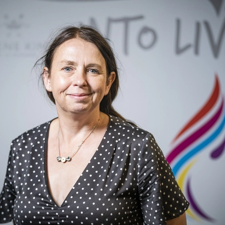 An image of Cathy Button smiling at the camera.
