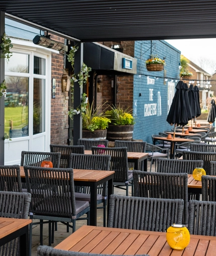 Exterior and beer garden of the Cricketers pub in Southwick