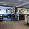 Interior dining area of a pub with a TV.