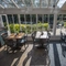 The interior conservatory restaurant seating area at The Crown & Horseshoes.