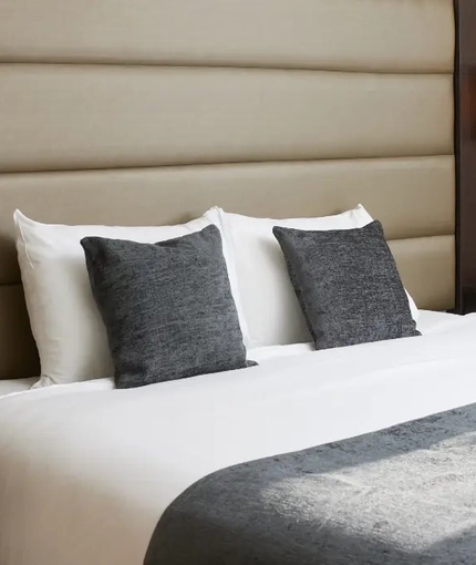 The interior of one of the hotels room featuring a double bed at The Quays.