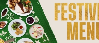 A Christmas banner promoting the 'Festive Menu' for Flaming Grill venues.