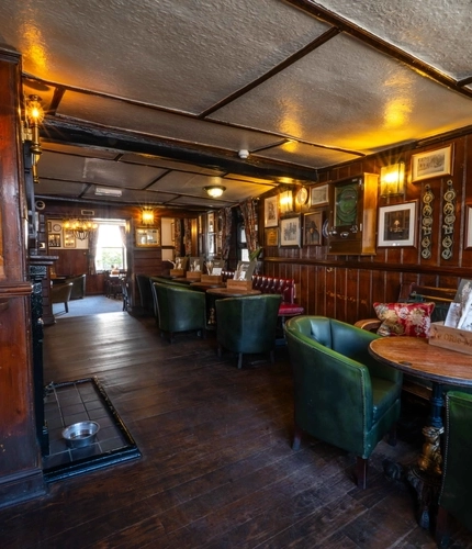 The interior restaurant seating area of Ye Olde Mitre in Barnet.