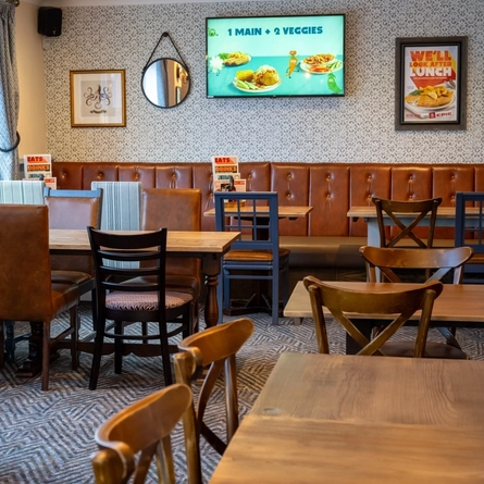 The interior restaurant seating area with TV, at The Star in Gillingham.