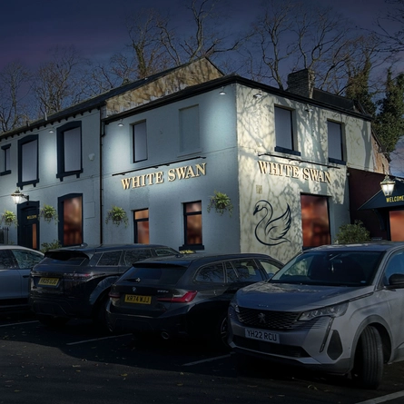 The exterior facade and car park at The White Swan.