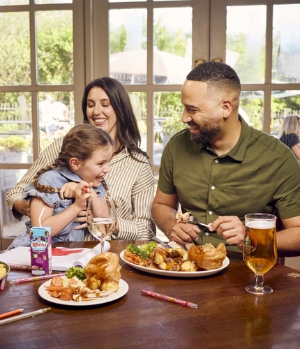 A family enjoying a meal at a Farmhouse Inns venue.