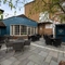 Exterior beer garden of a pub with a seating area.