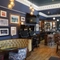 The interior bar and seating area with TV and pub games at Shakespeares in Edinburgh.