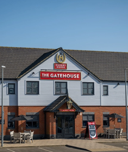 The exterior facade and seating area at the Gatehouse.
