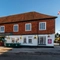 The exterior facade and signage of The White Hart in Frimley.