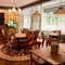The interior restaurant and seating area with lit fireplace at the Queens Head.