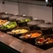 An image focusing on the interior carvery area with a selection of vegetables at The Farmhouse Kitchen Willington.
