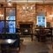 interior dining area of a pub with a fireplace