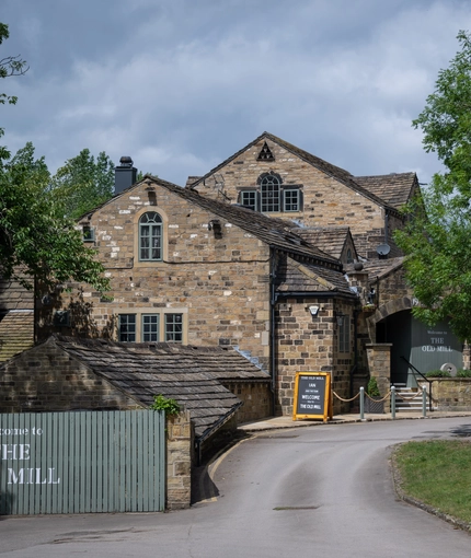 The exterior facade with signage of the Old Mill.