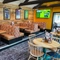 The interior restaurant and seating area with TV at the Pack Horse.