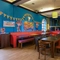 interior of the restaurant with a seating area