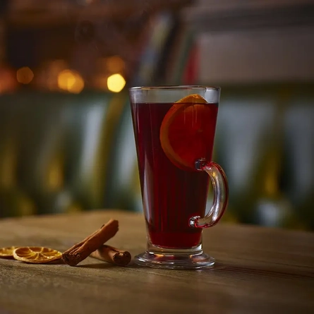 A mug of mulled wine on a table.