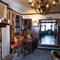 The interior restaurant seating area with fireplace, at Ye Olde Mitre.