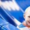 A child on a slide in the Wacky Warehouse play area
