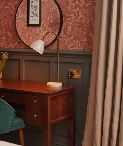 Hotel room dressing table with mirror and chair 