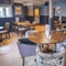 Interior dining area of a pub with a bar.