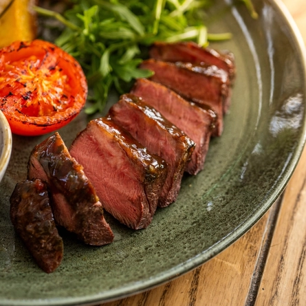 A close up of a Chimichuri Flat Iron steak special on the Summer Community Pubs with Food menu.