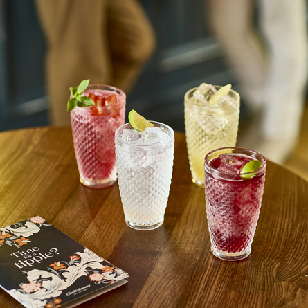 An advertising image of 4 cocktail style drinks sat on an interior table from the Autumn/Winter Chef & Brewer menu.