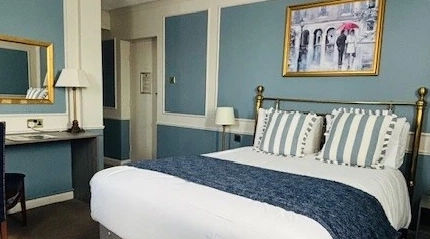 A double bed in bedroom 12 at the Coleshill Hotel.