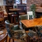 The interior restaurant seating area with tables, chairs and brick log burner fireplace at The Church View Inn.