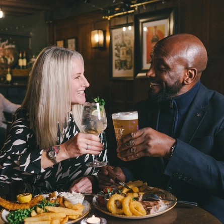 Couples enjoying a valentines meal at a Greene King Heritage vanue.