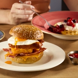 A graphic banner advertising the big breakfast roll served at Hungry Horse venues.