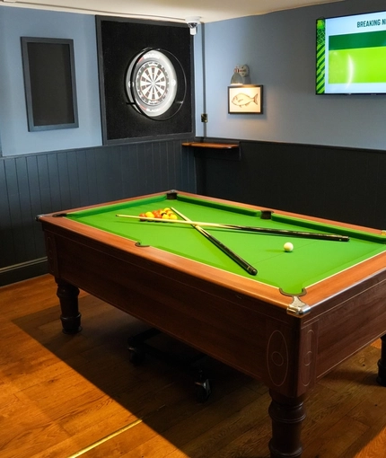 The pool table, dartboards and TV inside The Peregrine in Newcastle-Upon-Tyne.