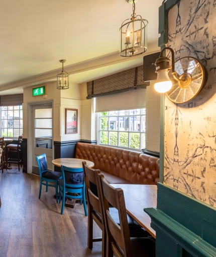 interior of the restaurant and seating area with TV