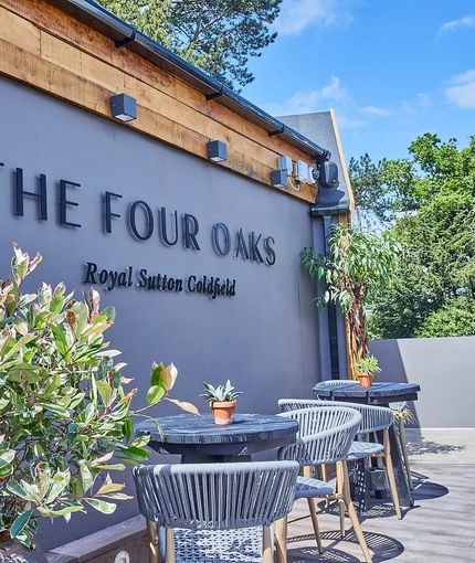 The Four Oaks sign in their outdoor area